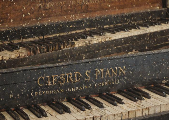 Complete piano restoration showing before and after comparison